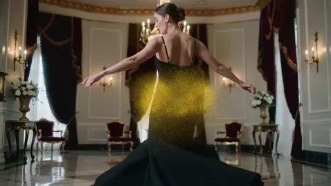 AI Video from prompt: Cinematic slow-motion shot, elegant woman in a g