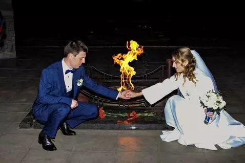 AI Video from prompt: With synchronized grace, the couple lowers thems