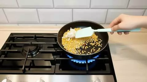 AI Video from prompt: Static camera shot. A black non-stick frying pan