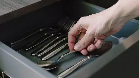AI Video from prompt: the hand takes the spoon from the kitchenware ki