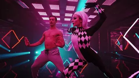 AI Video from prompt: In a neon-lit nightclub, the Harlequin dancer wi