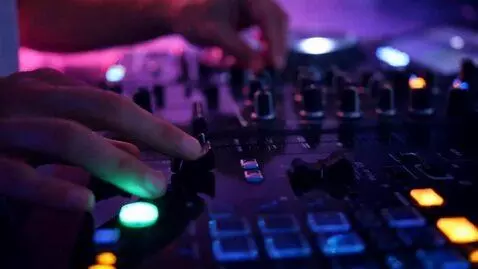 AI Video from prompt: **“Ultra-cinematic macro close-up of DJ equipmen