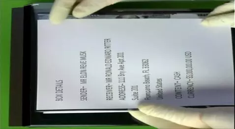 AI Video from prompt: Add movement of the hand and booklet as if it's 