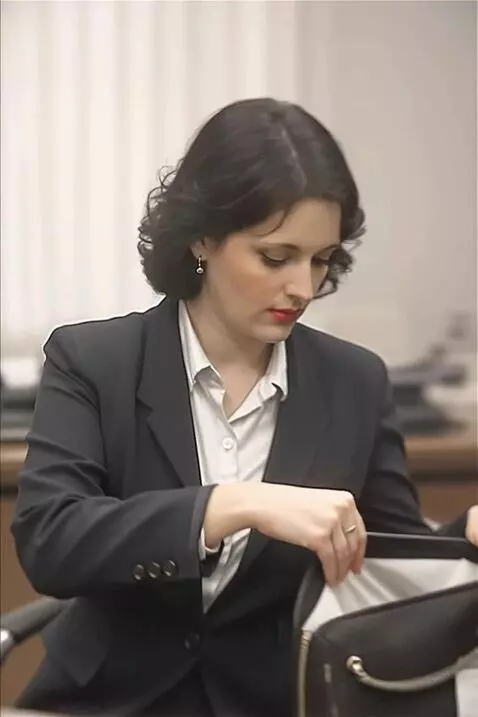 AI Video from prompt: Woman pulls out silently from below sanitary tow