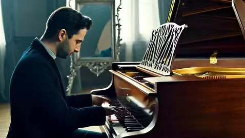 AI Video from prompt: A pianist plays an old instrument, his fingers m