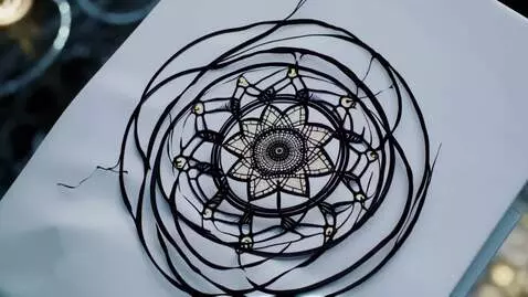 AI Video from prompt: A mesmerizing, slowly rotating sacred geometric 