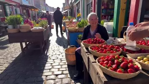 AI Video from prompt: Kyiv Rye Market. An old woman sells strawberries