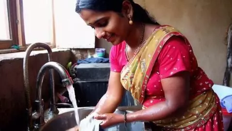 AI Video from prompt: Indian lady in saree washing clothes teasing