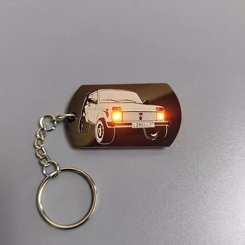 AI Video from prompt: Animate only the engraved Niva car on the metal 