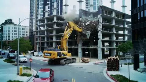 AI Video from prompt: Снос недостроенного многоэтажного здания в центр