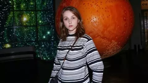 AI Video from prompt: A pretty young 25-year-old Russian woman with a 