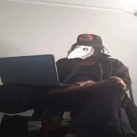 AI Video from prompt: The computer in the character's lap vanishes, an