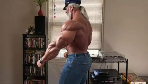 AI Video from prompt: a pro bodyuilder does a back double bicep pose a