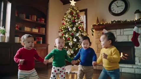 AI Video from prompt: 12 second long video babies dancing round a chri