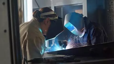 AI Video from prompt: A worker is welding with his laser welding machi