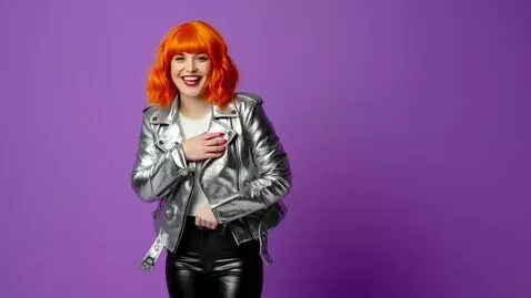 AI Video from prompt: 45 year old woman, short wavy orange hair with b