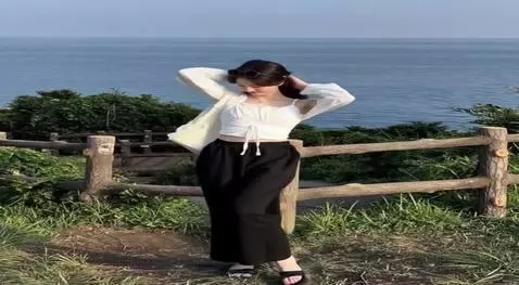 AI Video from prompt: The girl puts her hands behind her head, The gir