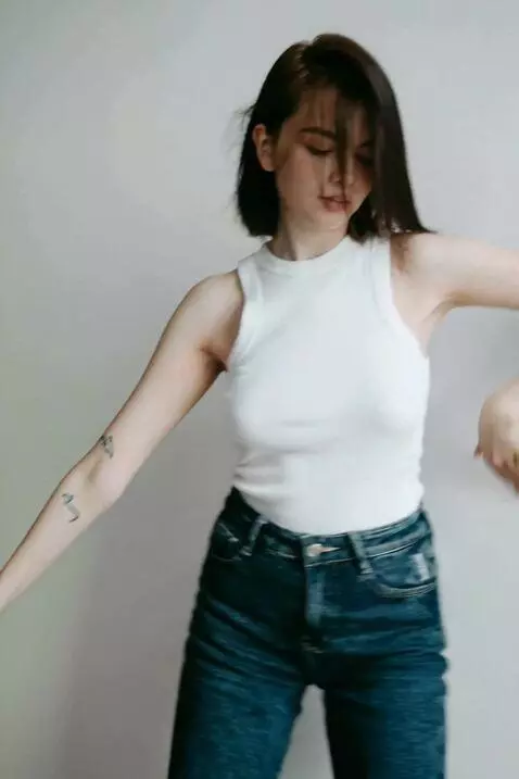 AI Video from prompt: Studio-style shooting. HD. A girl dances a rhyth