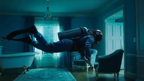 AI Video from prompt: Surreal Dreamcore visual. A diver in full vintag