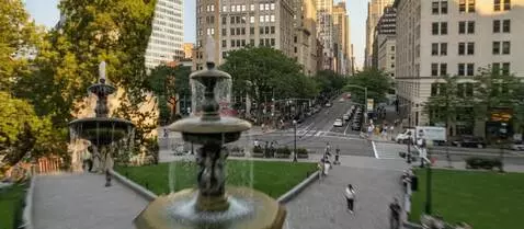 AI Video from prompt: A high-speed flight over the park into the windo