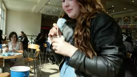 AI Video from prompt: A pretty young 25-year-old plump woman with a pl