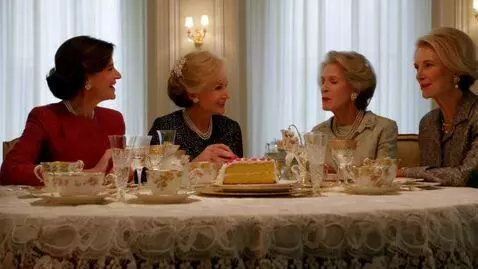 AI Video from prompt: Four glamorous older women sitting around a tabl