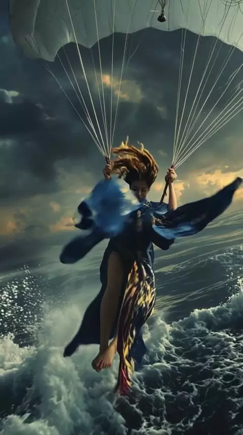 AI Video from prompt: A woman in a flowing blue kimono with gold embro