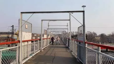 AI Video from prompt: The overhead crossing is falling apart