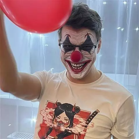 AI Video from prompt: The man in the photo turns into an evil clown wi