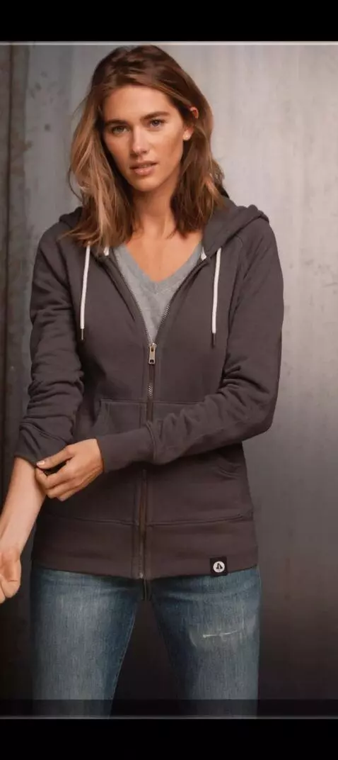 AI Video from prompt: Make her quickly roll both sleeves up fully, mai