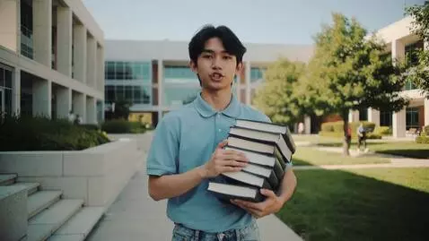 AI Video from prompt: A young Asian university student standing in fro