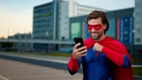 AI Video from prompt: A superhero beaming with pride, using a smartpho