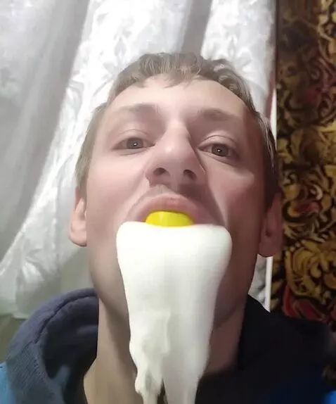 AI Video from prompt: Изо рта льется белая густая жидкость а в конце о