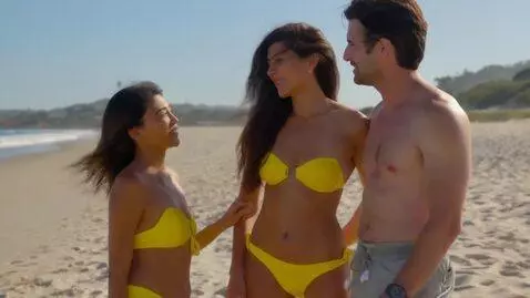 AI Video from prompt: 18 yo in yellow bikini teases old men on a beach