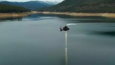 AI Video from prompt: Fixai drops a mine into a lake from a helicopter