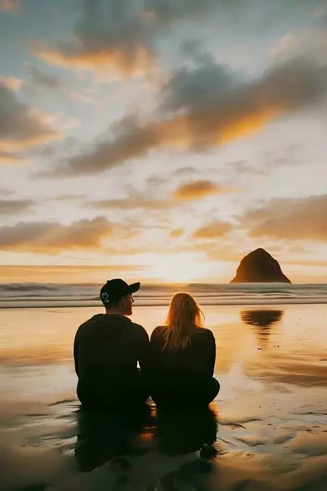 AI Video from prompt: a wave comes in and soaks the couple sitting on 