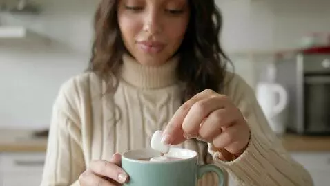 AI Video from prompt: Laura Love is seen dropping a marshmallow into a