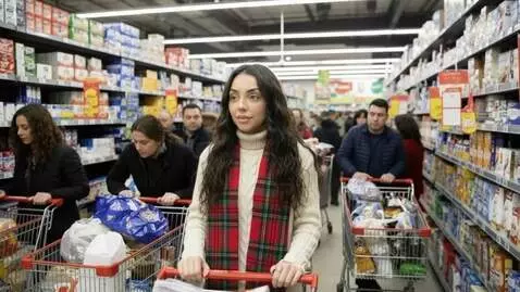 AI Video from prompt: Laura Love is seen slowly moving her shopping ca