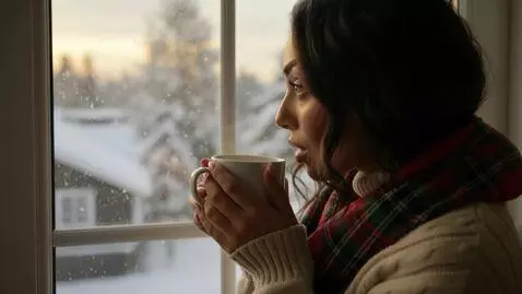 AI Video from prompt: Laura Love is being videoed looking outside of h