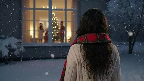 AI Video from prompt: Laura Love is seen viewing a family from a pictu