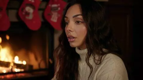 AI Video from prompt: Laura Love is seen contemplating Christmases tha