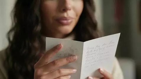 AI Video from prompt: Laura Love is seen in contemplation as she reads