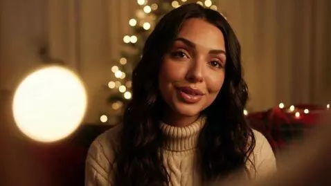 AI Video from prompt: Laura Love is singing to the camera about the Ch