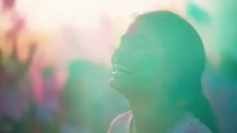 AI Video from prompt: A vibrant explosion of powdered pigments fills t