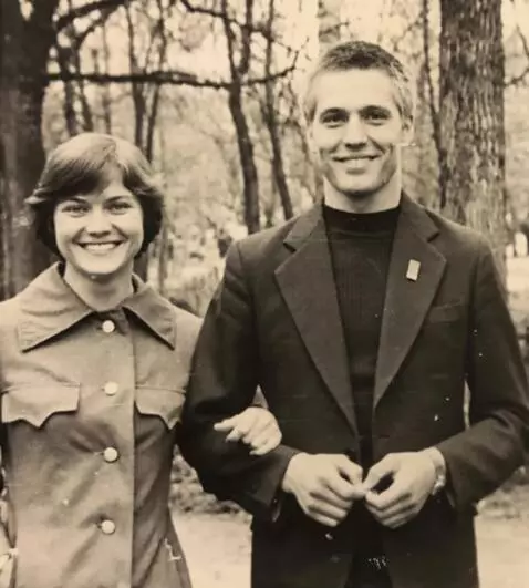 AI Video from prompt: a man and a woman walk forward and smile. do not