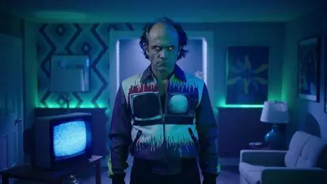 AI Video from prompt: The TV man is looking at the camera. A creepy re