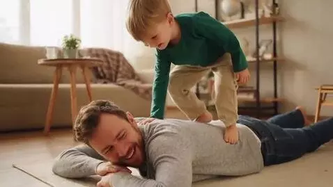 AI Video from prompt: white caucasian boy walking on his dad's back