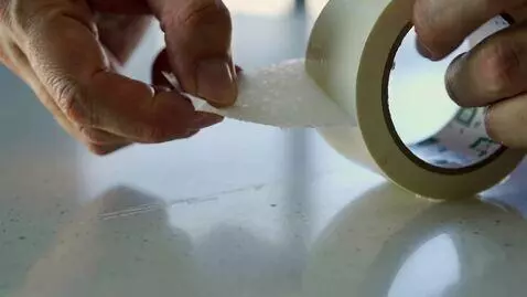 AI Video from prompt: Real-life close-up video showing a person applyi