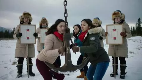 AI Video from prompt: To the right of the young women stands a group o