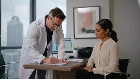 AI Video from prompt: make a video where a doctor is writing a prescri